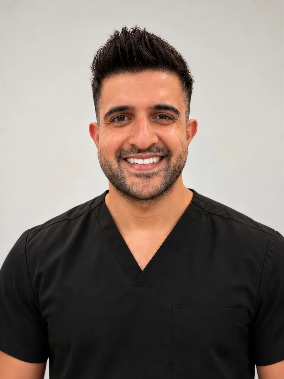 Dr Vikas Prinja in black scrubs